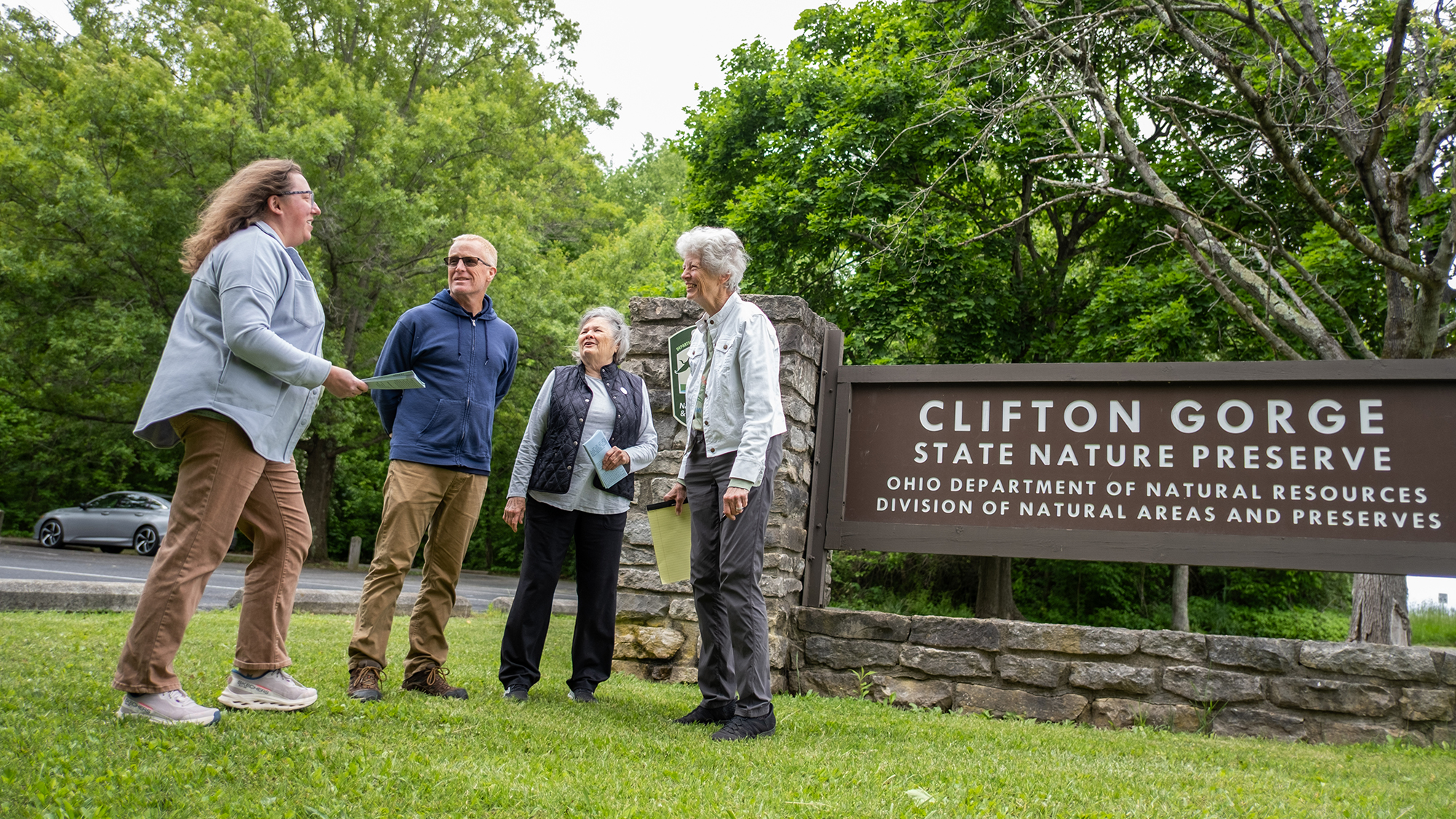 Researcher Brent Sohngen speaks with colleagues outside of Clifton Gorge State Park