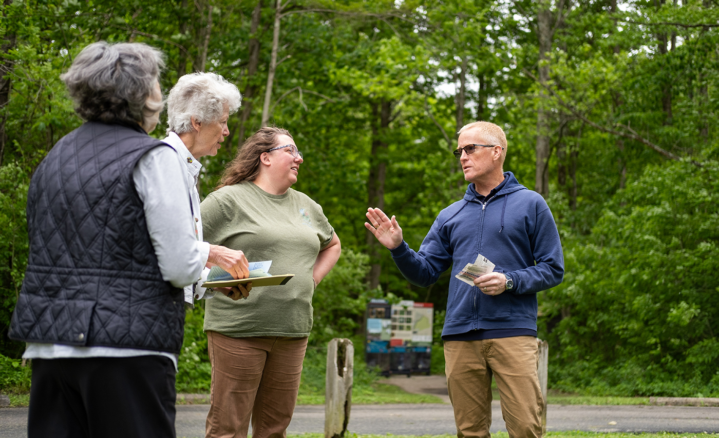 Ohio State researcher Brent Sohngen speaks with colleagues