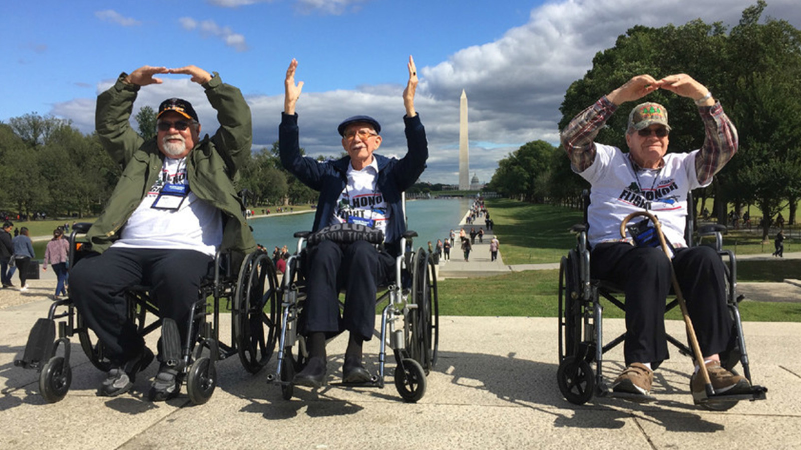 Three veterans spell OHIO using the Washington Monument as the I