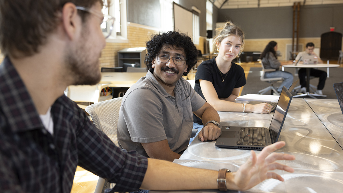 Three students collaborate in the BuildX space in Pomerene Hall.