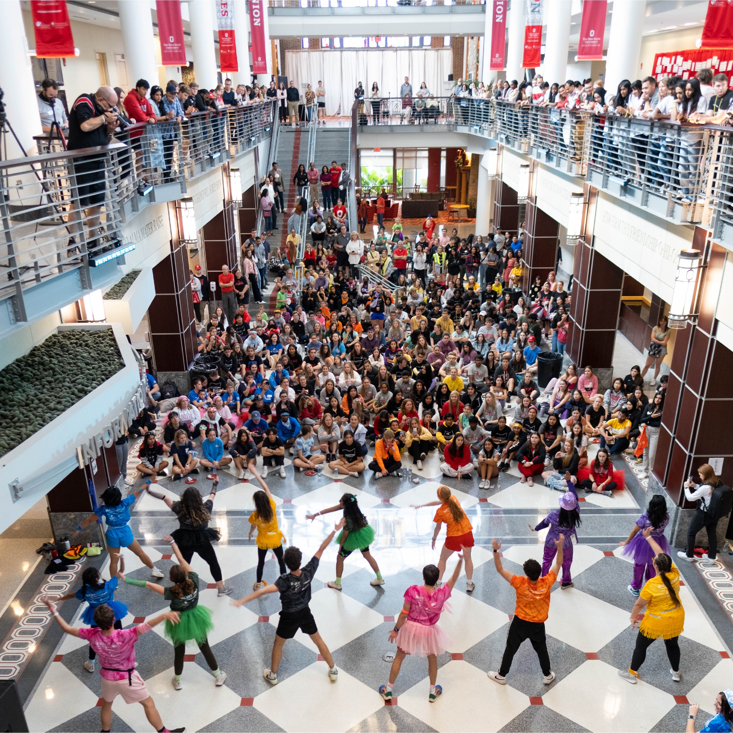 An overheard view of students performing in front of a large audience in the atrium of the Ohio Union on Ohio State's Columbus campus.
