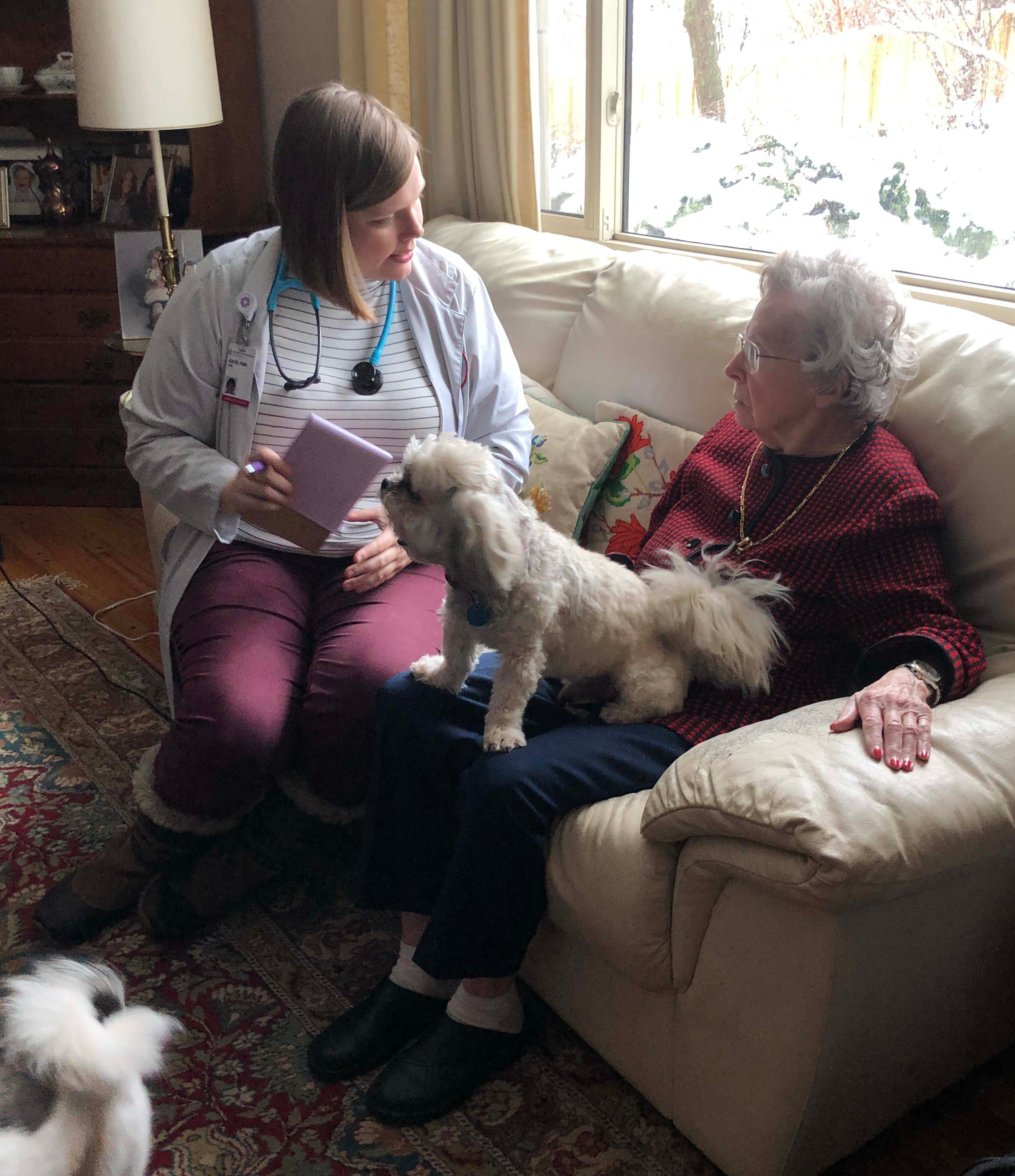 Pet owner talking with nursing student 