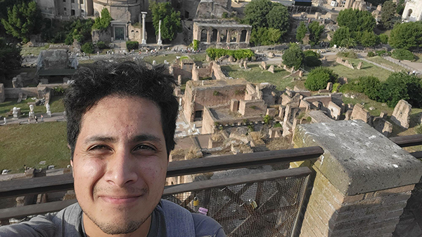Sam Cortes posed before Greek ruins