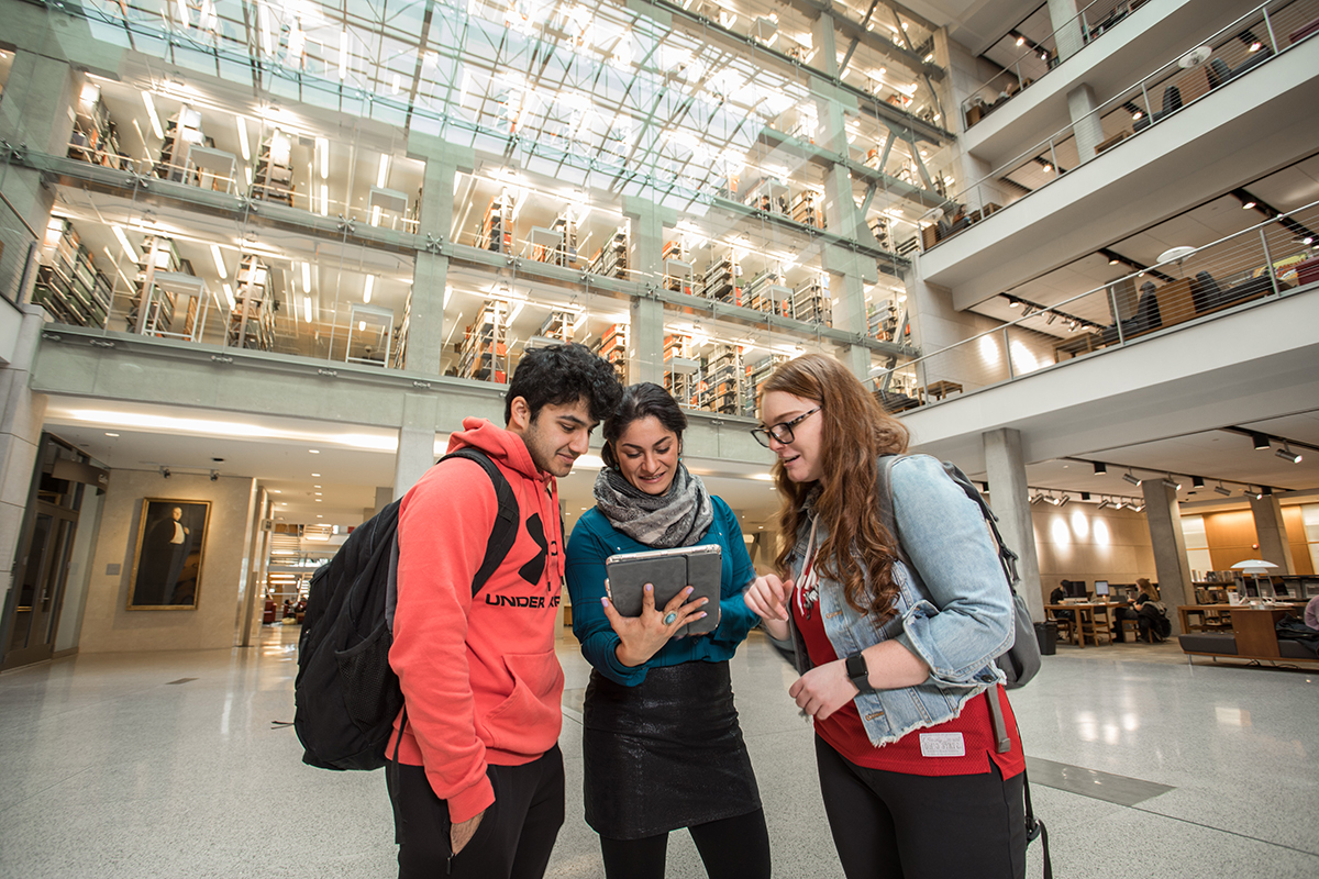 Students interacting in the library.