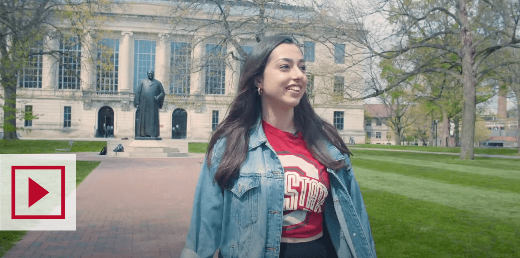 Video thumbnail still of a student walking on campus from the “Welcome to Ohio State video.”