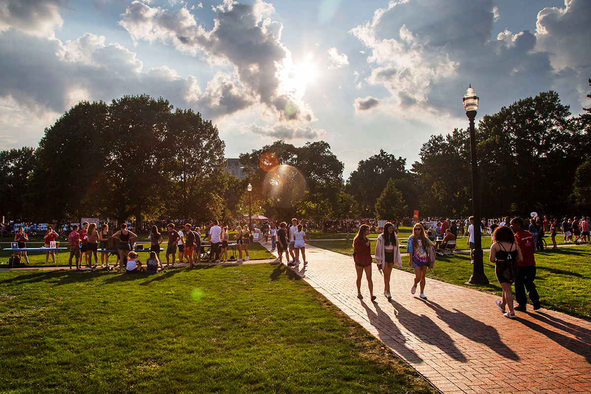 Students walk across the Oval during Student Involvement Fair