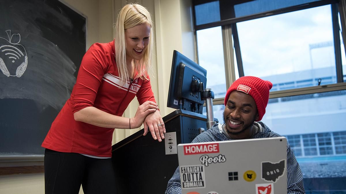 Ohio State professor helps student while looking at his laptop
