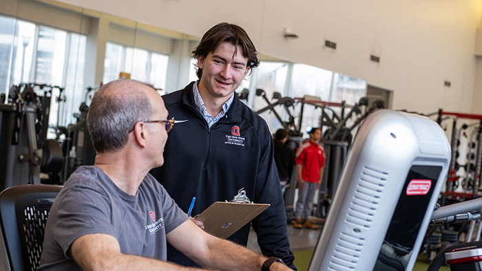 Anthony Dujmovic works with Terry Rodeman in the Fitness Training Lab