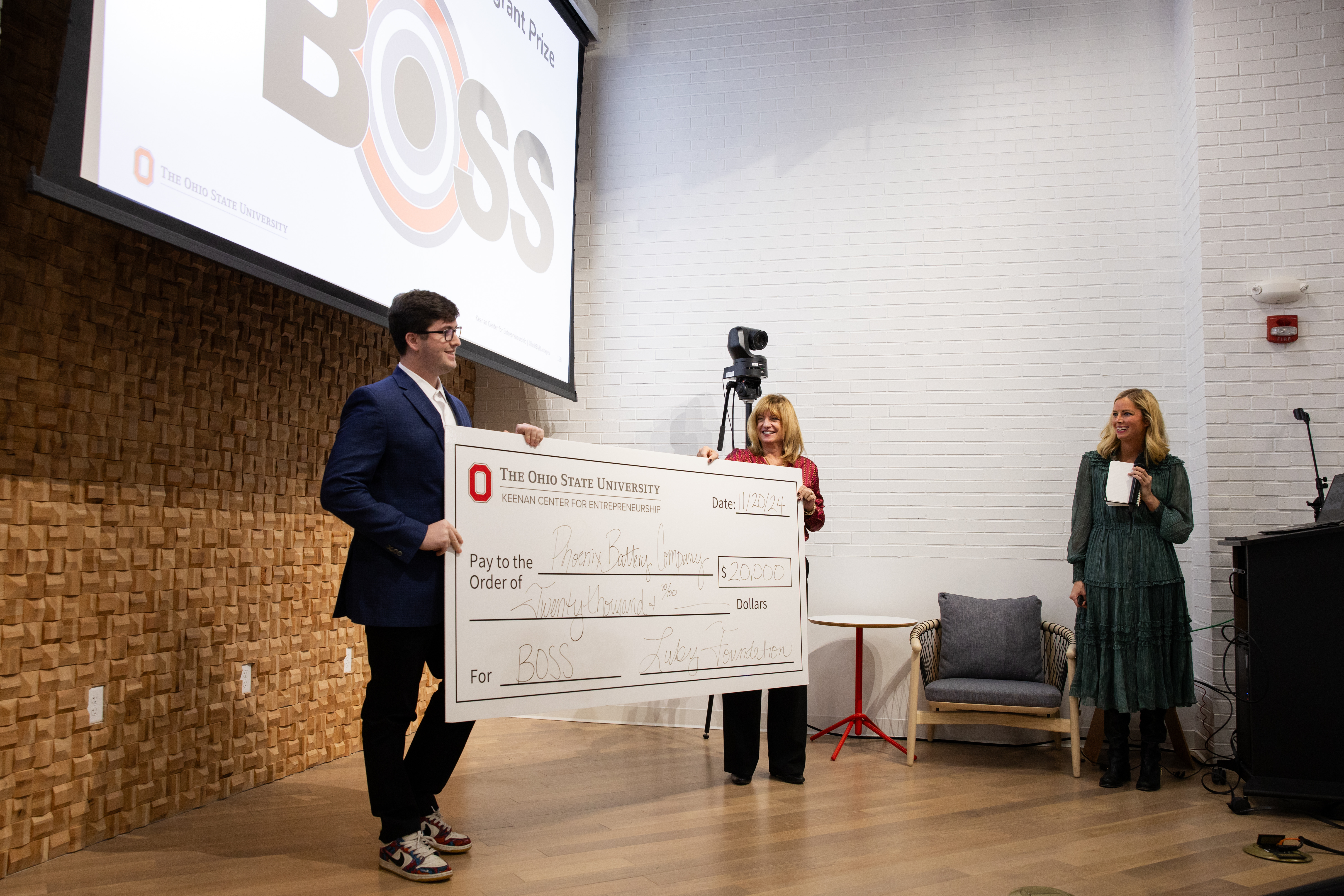 Jonah Mikesell receiving a giant check.