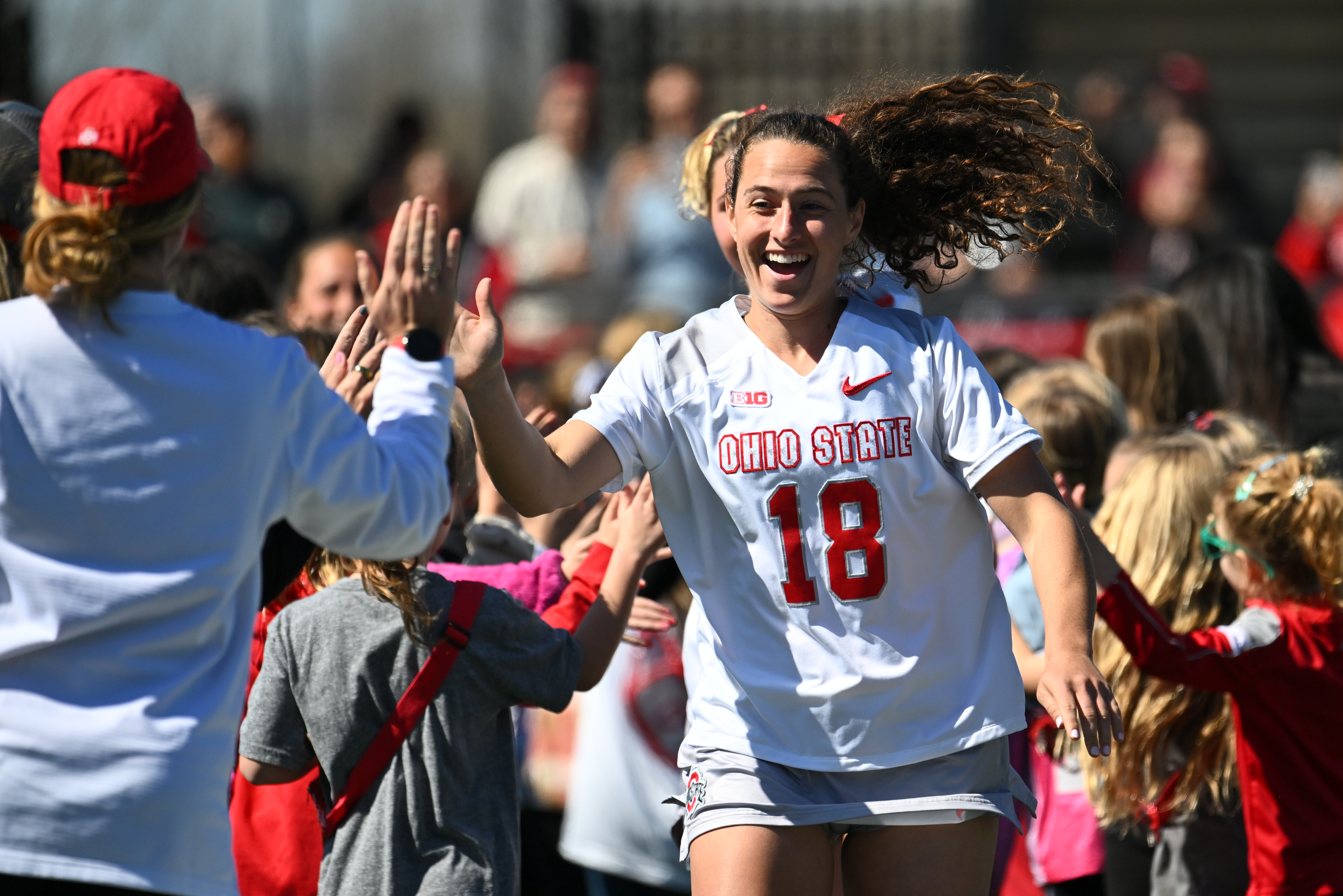 Amani Kimball-McKavish high-fives a teammate.