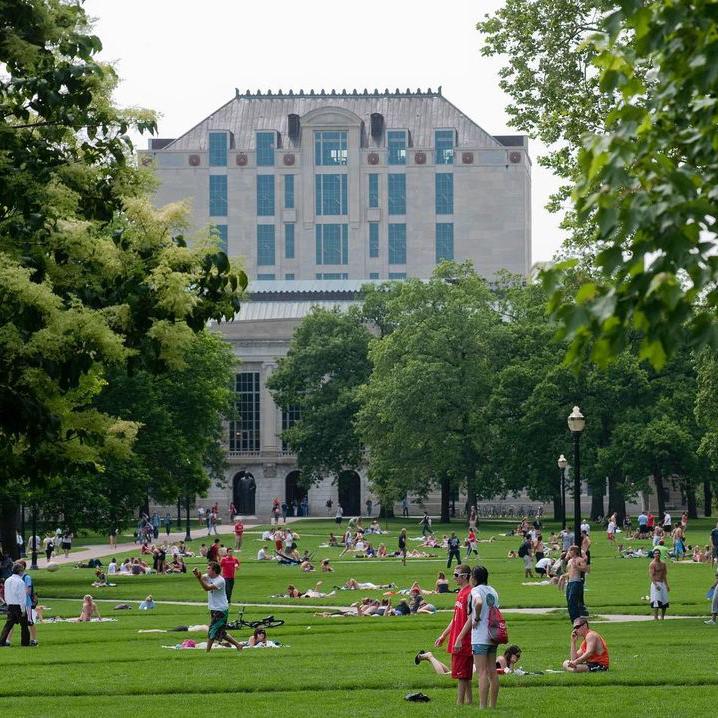 People on the Oval with Thompson Library in the background