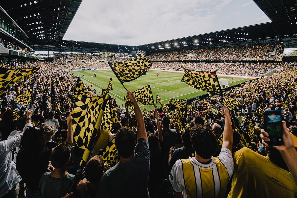 Fans cheering at Columbus Crew soccer game. Photo by Experience Columbus; Columbus Crew