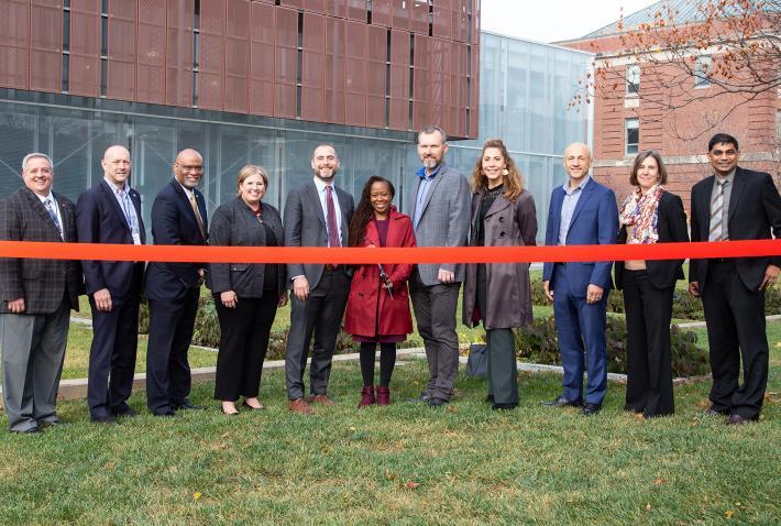 Leaders from DOE, Ohio State, Lawrence Berkley National Laboratory, AEP and ENGIE cut  a commemorative ribbon in front of the East Regional Chilled Water Plant.