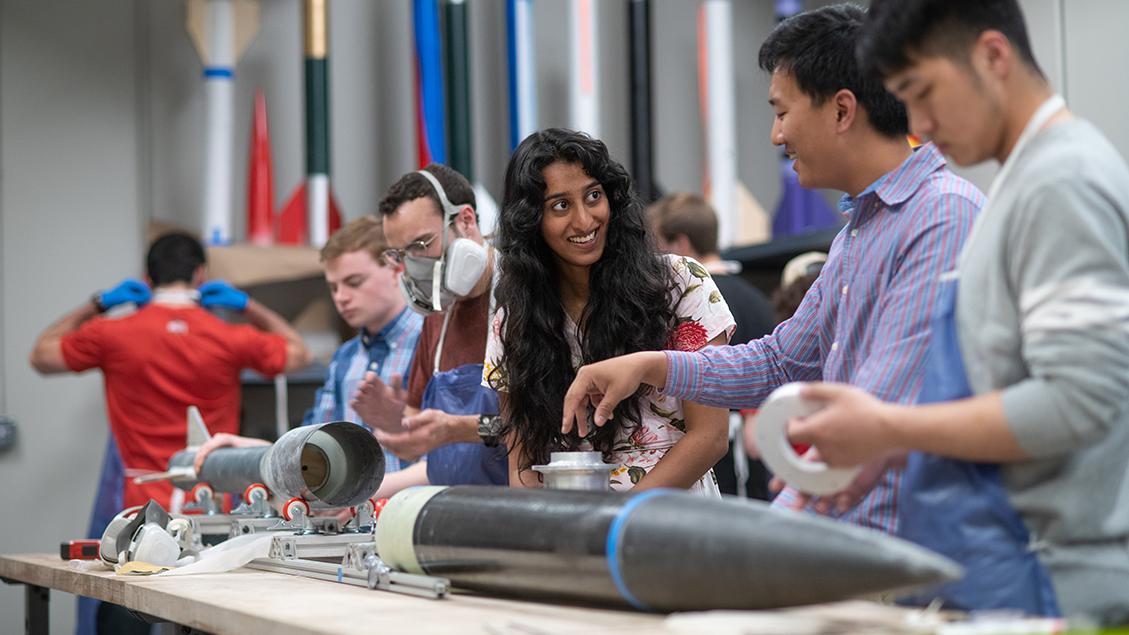 Two students interact as they work together on a research project