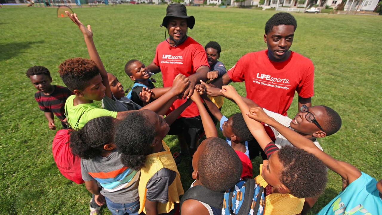 A group of children with all hands together