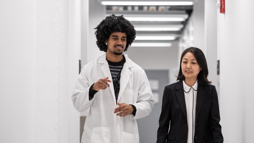 Emanuel Tewolde talks with his professor Min-Ae Song.